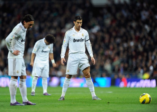 MADRID, SPAIN - JANUARY 22: Cristiano Ronaldo (R) of Real Madrid lines up a free kick beside Mesut Ozil during the La Liga match between Real Madrid and Athletic Bilbao at estadio Santiago Bernabeu on January 22, 2012 in Madrid, Spain. (Photo by Denis Doyle/Getty Images)